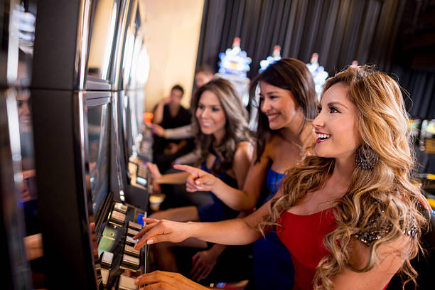 hp77 app showing Phoenix Rises slot game with live casino table in background